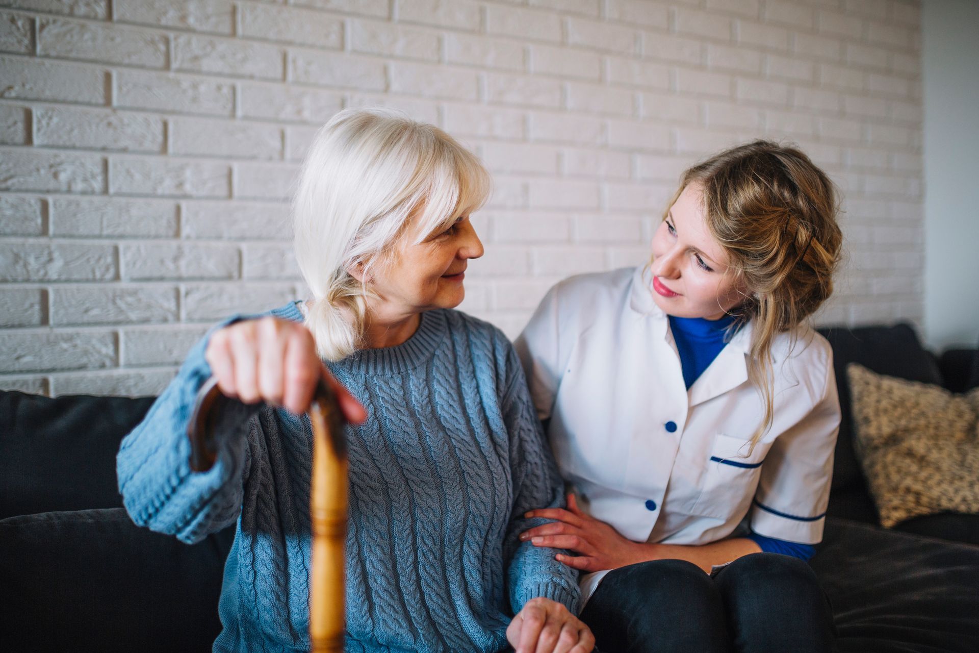 Nurse smiling with a senior resident